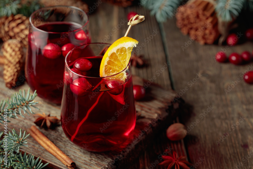 Christmas drink with spices, orange, and cranberries. Christmas drink with spices, orange, and cranberries.