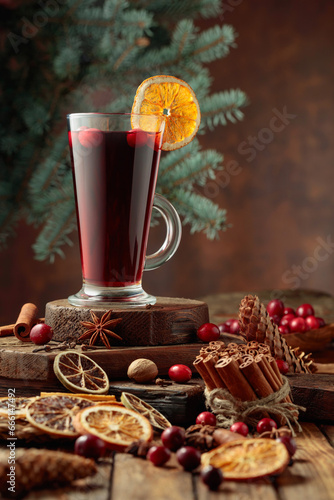 Hot Christmas drink with spices  dried citrus  and cranberries.