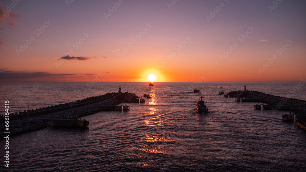 The beautiful harbour in the Polish town of Kolobrzeg at sunset on the Baltic Sea. Taken from a drone. Kołobrzeg 