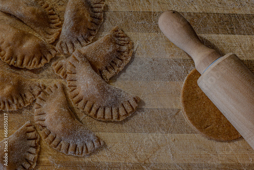 Wallpaper Mural Traditional italian ravioli. Homemade italian pasta.Fresh ravioli on wooden board, top view Torontodigital.ca