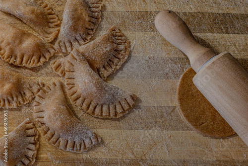 Wallpaper Mural Traditional italian ravioli. Homemade italian pasta.Fresh ravioli on wooden board, top view Torontodigital.ca