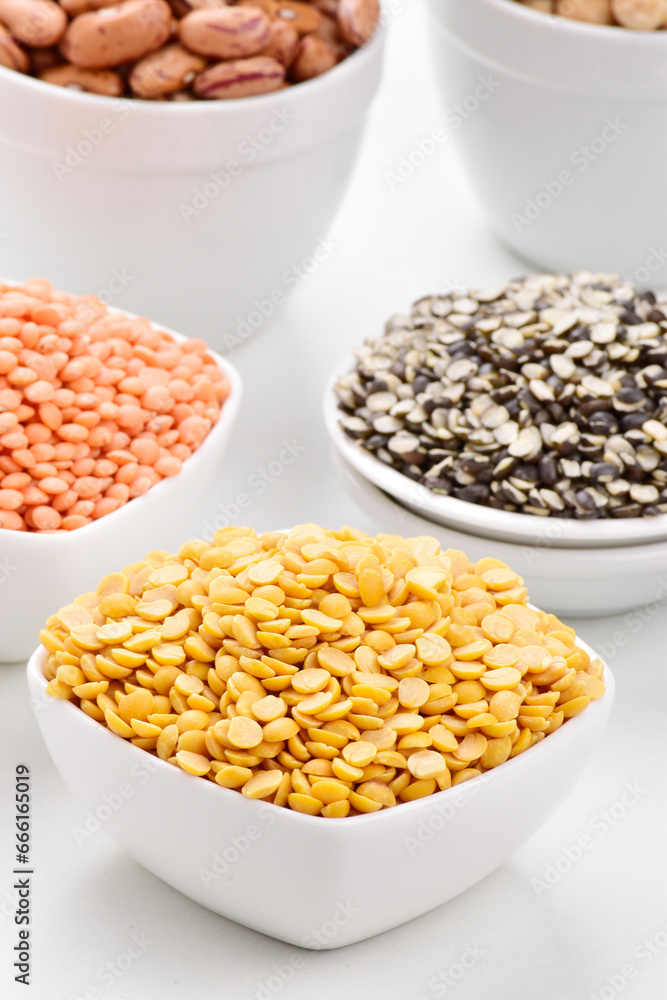 Raw chana dal in bowl on white background