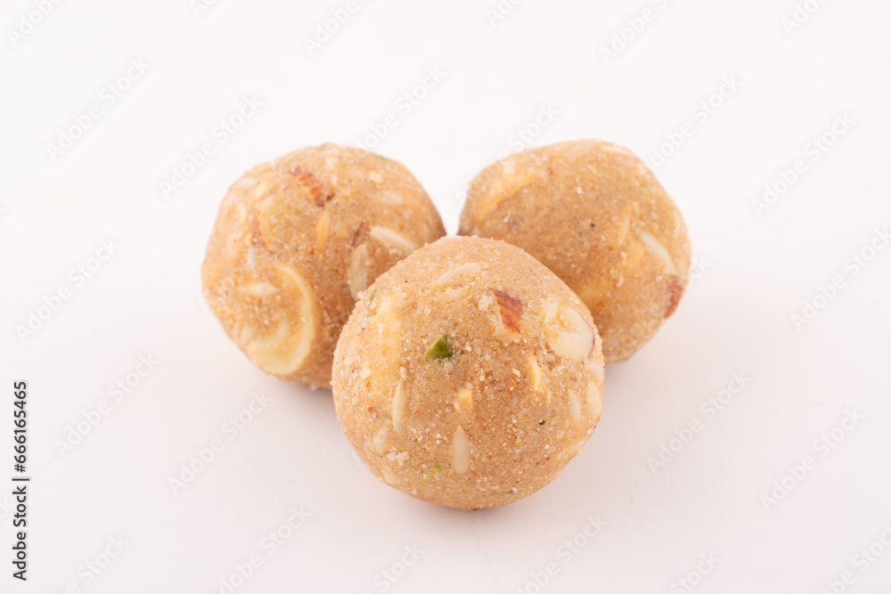 Panjiri ladoo mixed with dry fruits isolated on white background