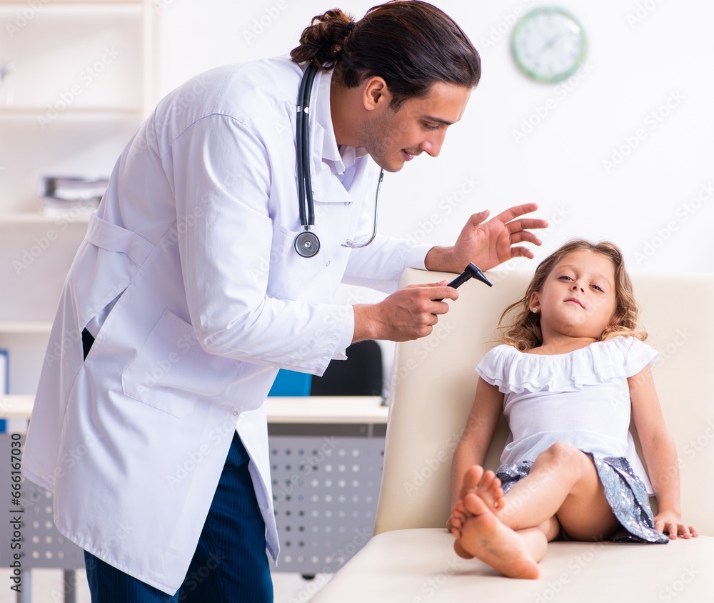 Young doctor pediatrician with small girl Young doctor pediatrician with small girl