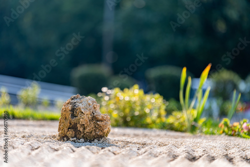 A decorative element with a large stone