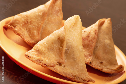 Samosa in plate on table