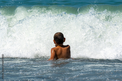 White boy swims in the black sea