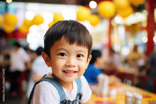 Joyful asian kid smiling in festive environment