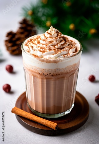 Christmas hot cocoa drink with whipped cream and cinnamon . New Year holidays and Christmas concept