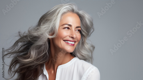 middle-aged woman studio portrait with beautiful well-groomed hair 