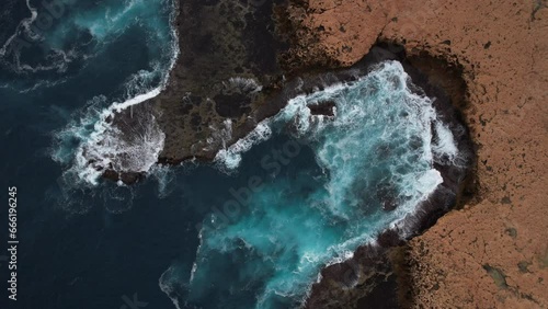 aerial video of waves crashing along the Great Australian Bite in 4k photo