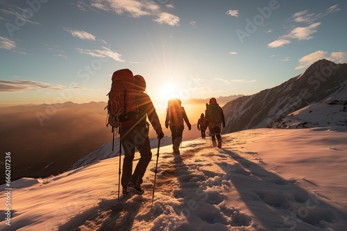 adventurous hikers group hiking on a snowy mountain in cold weather © DailyLifeImages