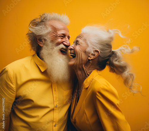 An elderly loving couple, grandparents warm themselves with love, hugs and laughter on cold winter days. A love that lasts forever.
