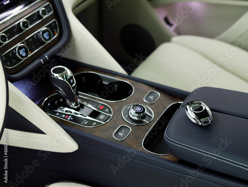 View of automatic transmission of expensive premium car inside cabin. interior of beautiful SUV © AvokadoStudio