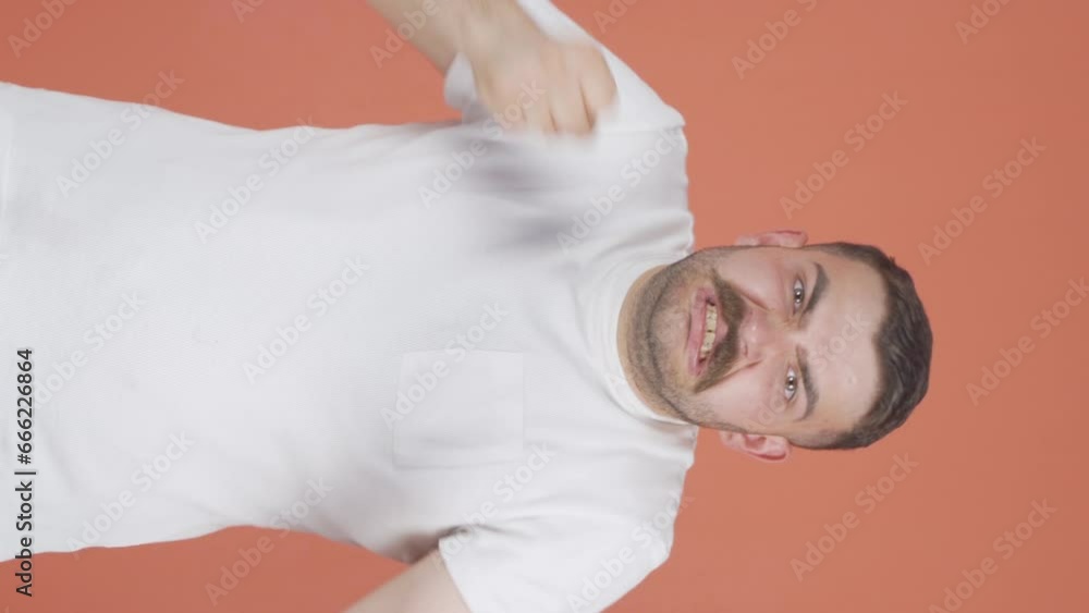Vertical video of Man having a nervous breakdown in front of the camera. Vertical video of Man having a nervous breakdown in front of the camera.