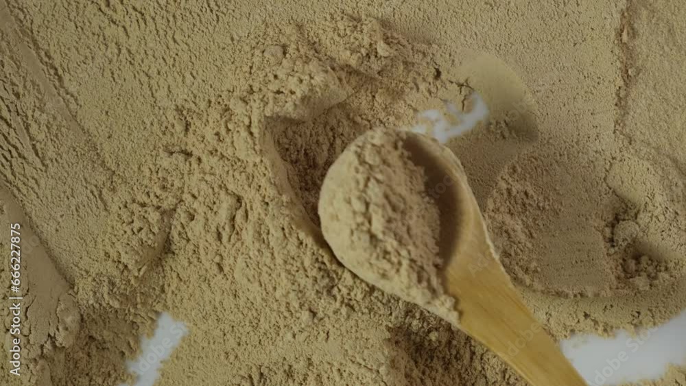 Maca powder on the table, top view. Maca gelatinized flour, close-up. Peruvian superfood, natural food supplement used for healthy drinks, cocktails and smoothies. 4K video. Maca powder on the table, top view. Maca gelatinized flour, close-up. Peruvian superfood, natural food supplement used for healthy drinks, cocktails and smoothies. 4K video.