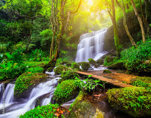 beautiful waterfall in green forest in jungle at phu tub berk mo photo