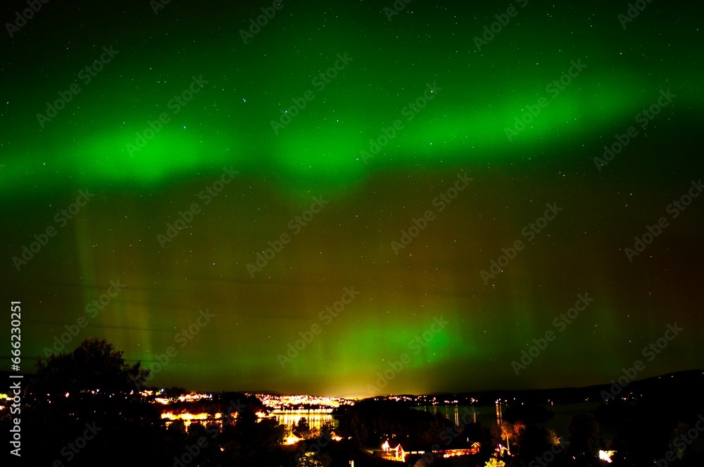 Idyllic night scene of Tromso, Norway featuring the stunning Northern Lights