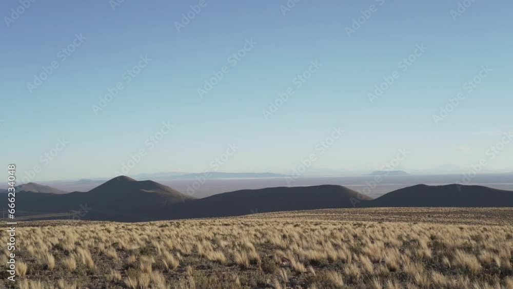 dry and arid landscape of the highlands of Bolivia in the Andes mountains of the altiplano. dry and arid landscape of the highlands of Bolivia in the Andes mountains of the altiplano.