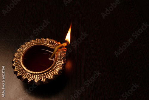 Closeup of diwali diya at dark