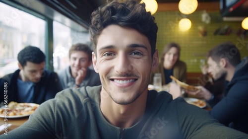 Young Man Smiles at Restaurant Table