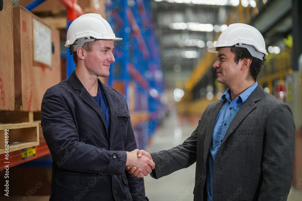 Portrait of engineer and apprentice in workshop of railway engineering facility Portrait of engineer and apprentice in workshop of railway engineering facility