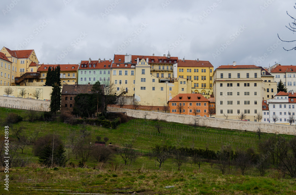 Obraz premium The view of historical buildings in Uvoz Street and the Saint John Vineyard in Hradcany, Prague, the Czech Republic