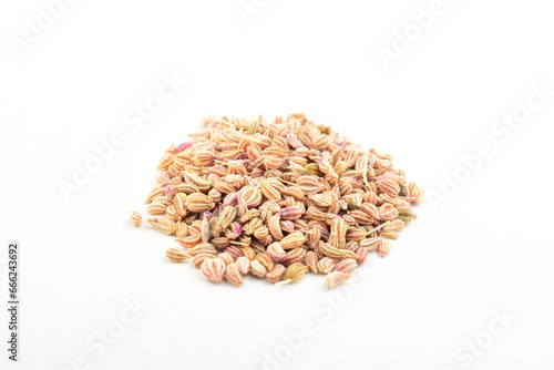 Carom seeds on white background