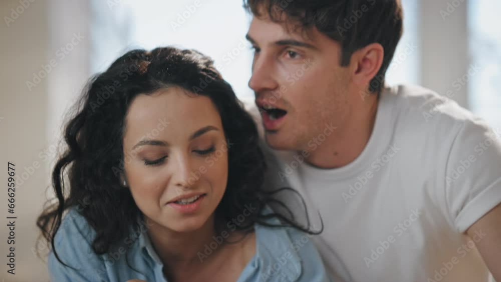 Loving pair eating fruits laughing standing home close up. Happy family morning Loving pair eating fruits laughing standing home close up. Happy family morning