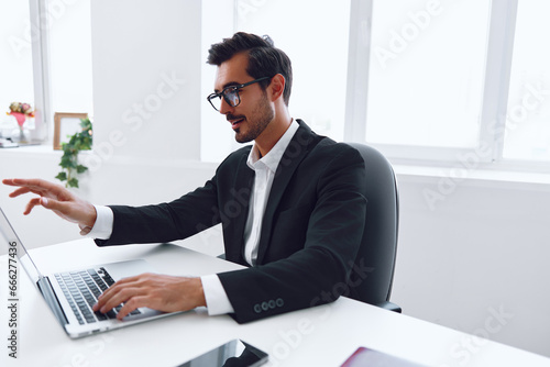 Man job office happy business businessman winner lifestyle suit white young technology laptop