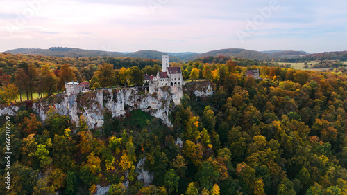 Aerial drone view medieval Lichtenstein castle on mountain  autumn Baden-Wurttemberg  Germany.
