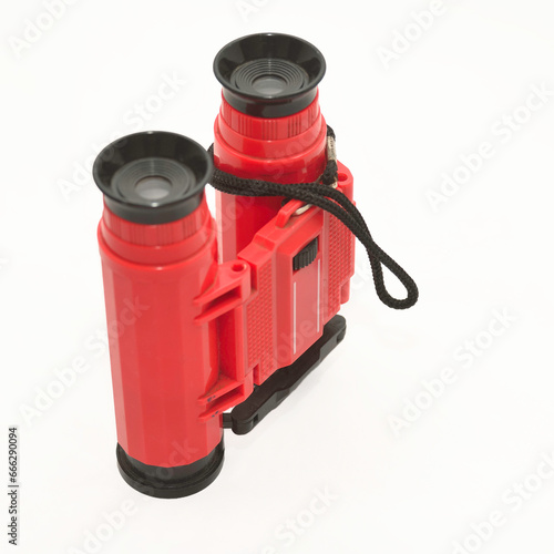 Toy binoculars on a white background