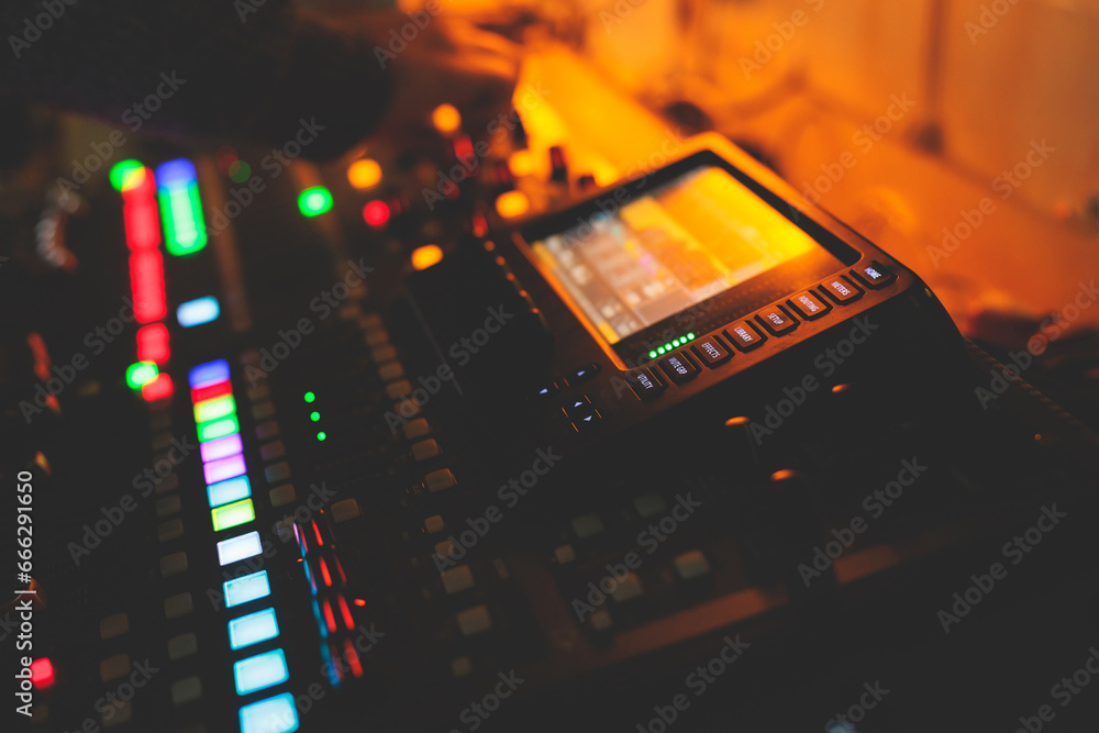 View of lighting technician operator working on mixing console workplace during live conference event, concert show broadcast, light mixer controller panel, workplace sound professional equipment View of lighting technician operator working on mixing console workplace during live conference event, concert show broadcast, light mixer controller panel, workplace sound professional equipment