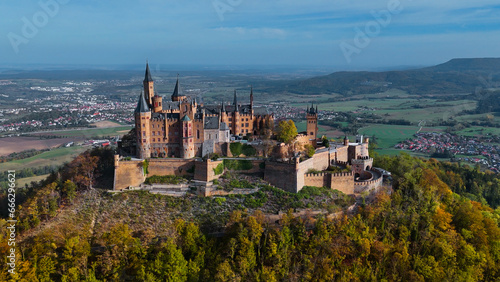 Aerial drone view of medieval Hohenzollern castle on top of hill in autumn, Baden-Wurttemberg, Germany © frolova_elena