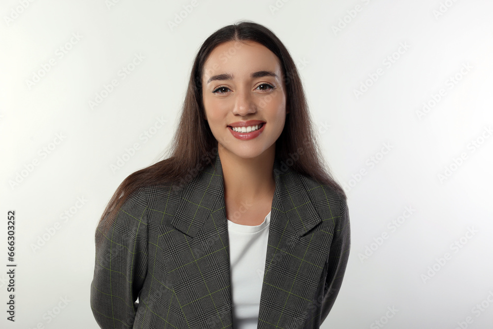 Portrait of happy young woman in stylish jacket on white background Portrait of happy young woman in stylish jacket on white background