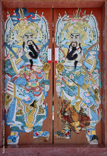 BANGKOK, THAILAND - OCTOBER 26, 2023: Painting of Chinese gods on a wooden door in The TungTrakul Trokchan Association, Thailand.