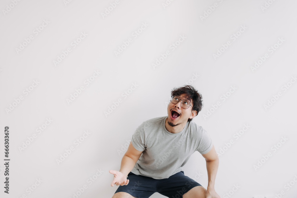 Bored hair asian man feel shocked and surprised isolated on white. Bored hair asian man feel shocked and surprised isolated on white.