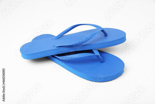 Stylish blue flip flops on white background