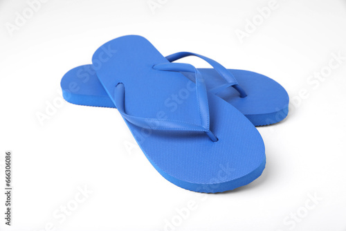 Stylish blue flip flops on white background