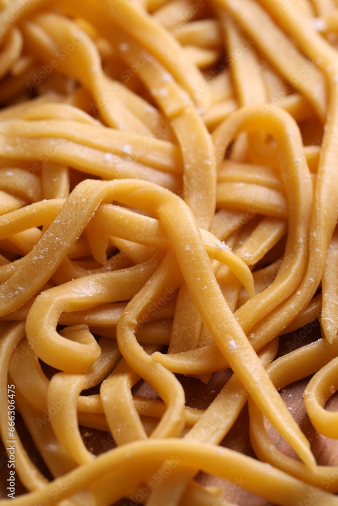 Raw homemade pasta on table, closeup view Raw homemade pasta on table, closeup view