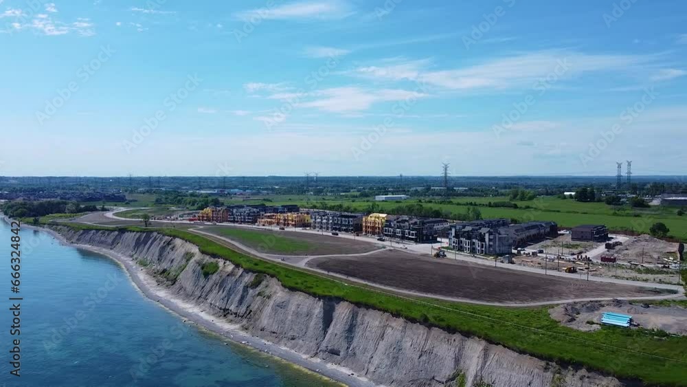 New semi-detached town homes under construction in lakeside community housing development near farmland in Ontario New semi-detached town homes under construction in lakeside community housing development near farmland in Ontario