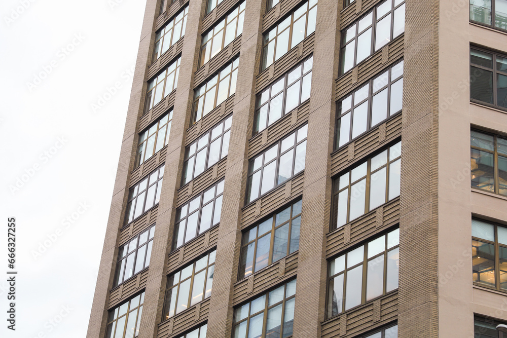 skyscraper, bathed in sunlight, symbolizes modernity, progress, and corporate success in the bustling urban landscape