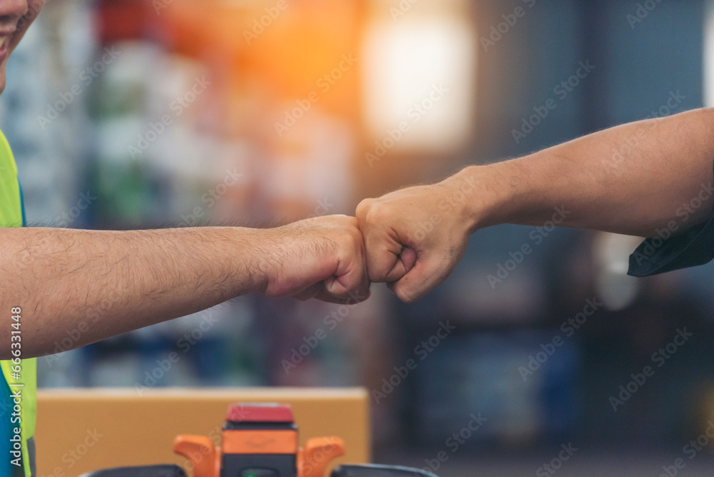 Diversity Teamwork Warehouse worker fist bump together trust partner. Engineer man, women hands partnership. Coworker colleague logistics Warehouse agreement. Multiracial Two people fist bump partner Diversity Teamwork Warehouse worker fist bump together trust partner. Engineer man, women hands partnership. Coworker colleague logistics Warehouse agreement. Multiracial Two people fist bump partner