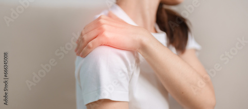 Woman having Shoulder and Neck pain during sitting on couch at home. Muscle painful due to Myofascial pain syndrome and Fibromyalgia, rheumatism, Scapular pain, Cervical Spine. ergonomic concept