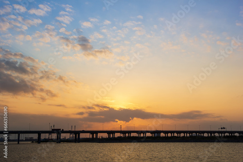 View of a pier during sunset © shengyi