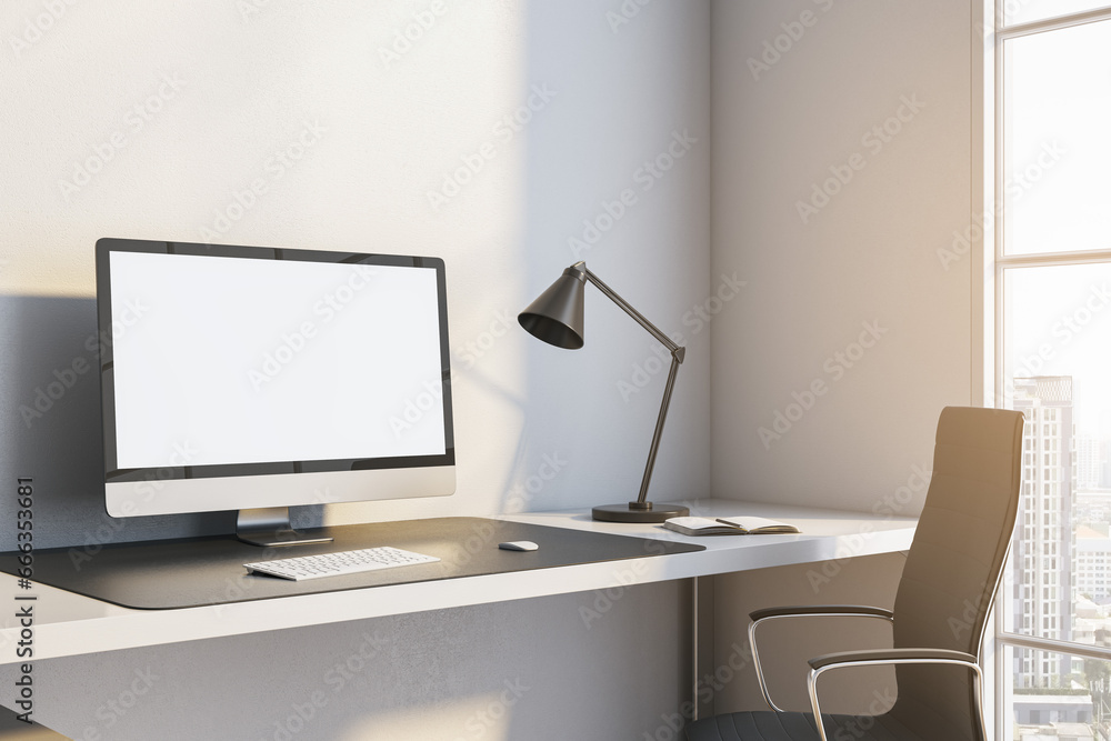 Close up of modern workplace with mock up place on white computer monitor, lamp and window with city view and daylight. 3D Rendering. Close up of modern workplace with mock up place on white computer monitor, lamp and window with city view and daylight. 3D Rendering.