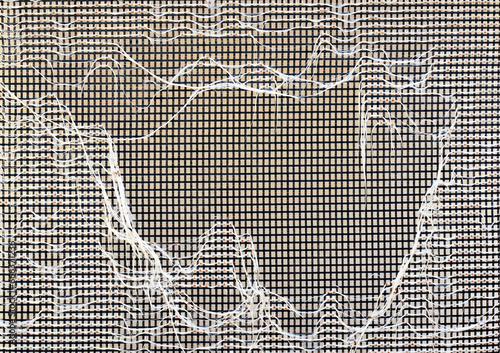Mesh chair with cat scratches. Old outdoor chair texture background. 