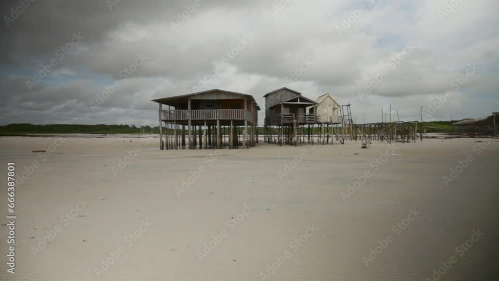 Handheld tilt down shot of wooden stilt houses, Brazil Handheld tilt down shot of wooden stilt houses, Brazil