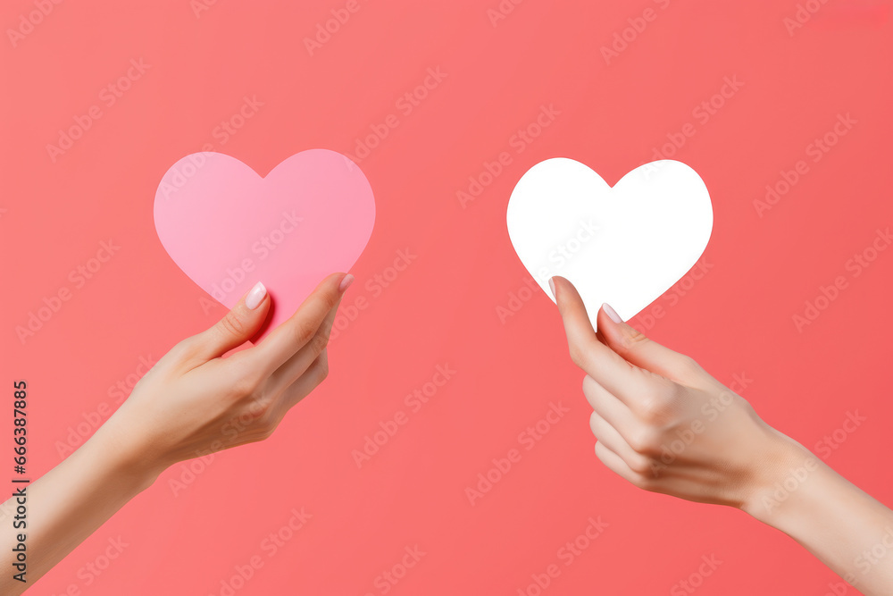 Two hands are holding paper hearts against pink background. This image can be used for various occasions and themes, such as love, relationships, Valentine's Day, and expressing emotions. Two hands are holding paper hearts against pink background. This image can be used for various occasions and themes, such as love, relationships, Valentine's Day, and expressing emotions.