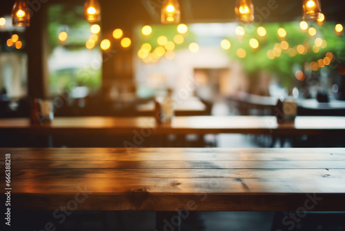 Picture of wooden table in restaurant with beautiful lights in background. This image can be used to showcase ambiance and cozy atmosphere of dining establishment.